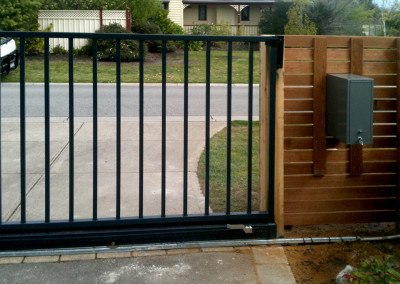 Horizontal Cedar Fence with Automatic Steel Electric Gate