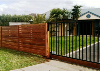 Horizontal Cedar Fence with Automatic Steel Electric Gate