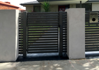 Steel Fence with Rendered Colums and Automated Electric Sliding Gate and Hinged Access Gate